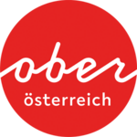 Logo Oberösterreich Tourismus: Roter Kreis mit weißem Oberösterreich-Schriftzug